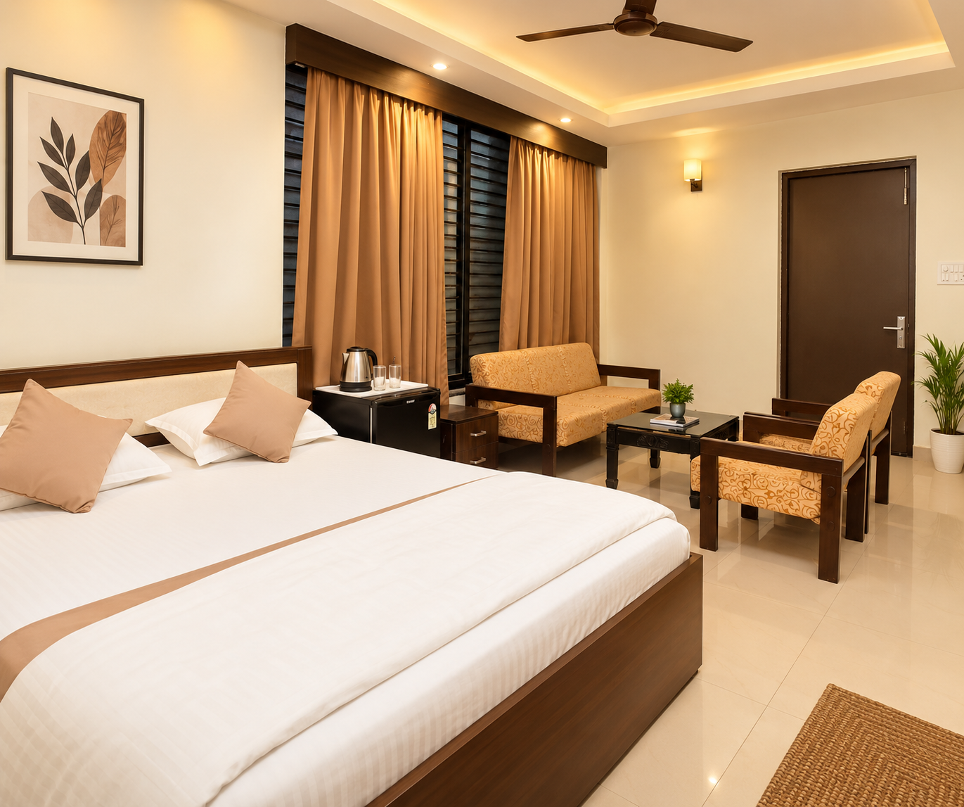 Guest room at Unwind Resort with king bed, seating and study table
